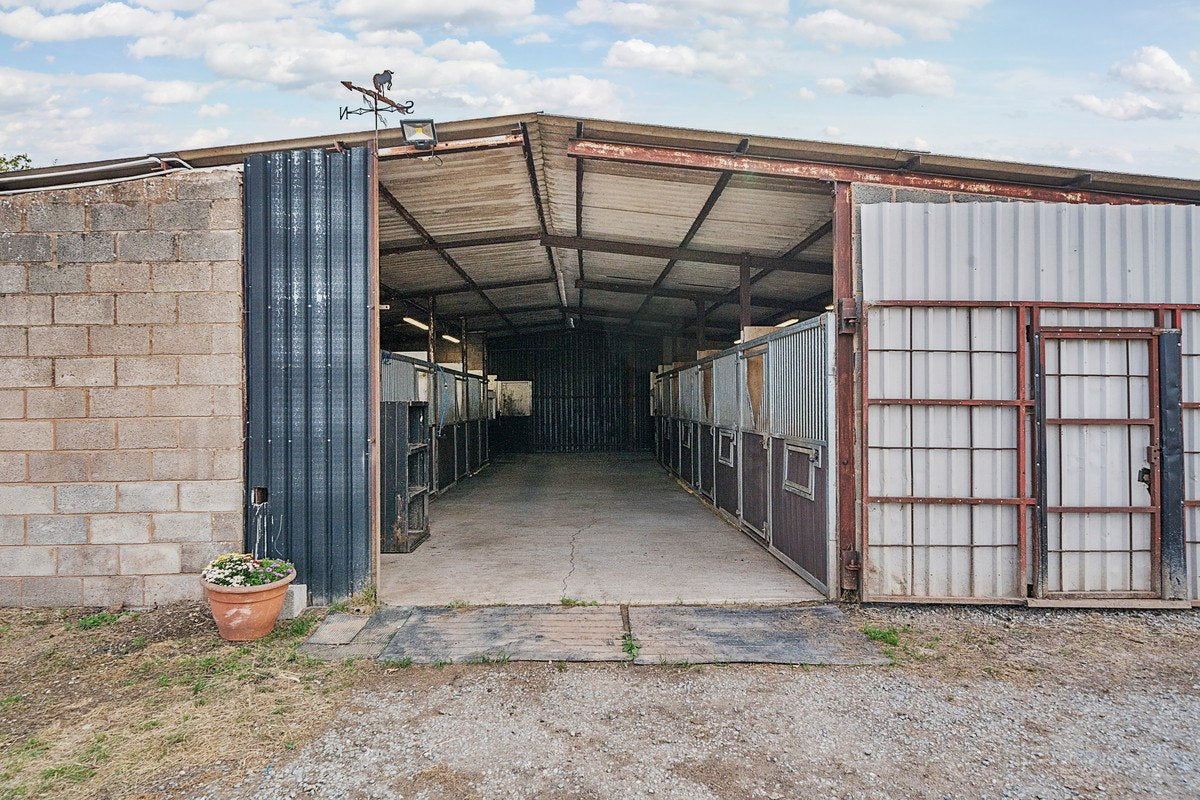 Stable entrance and yard facilities at Green Hollow Equestrian