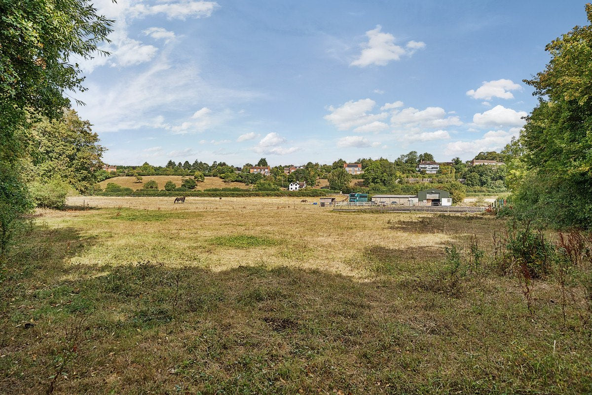 Sunlit paddocks and yard view at Green Hollow Equestrian